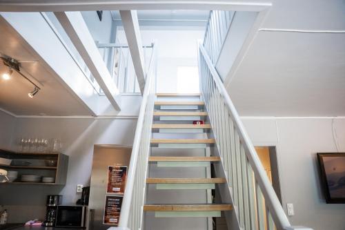 a staircase in a house with a white ceiling at Hemsedal Cafe Skiers Lodge in Hemsedal