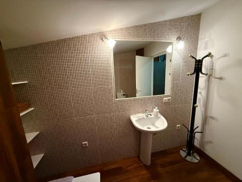 a bathroom with a sink and a mirror at CENTRO House in Alytus