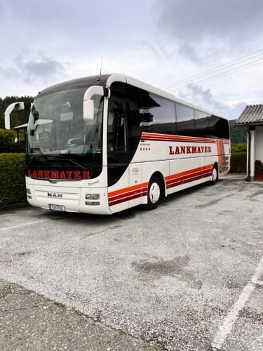 a large bus parked in a parking lot at Keutschacherhof in Keutschach am See