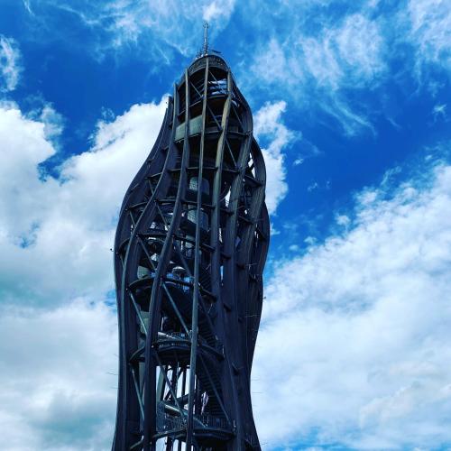 a tall black building with a sky in the background at Keutschacherhof in Keutschach am See