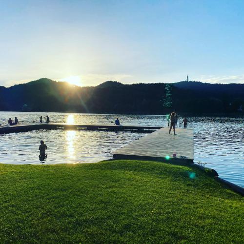 a group of people standing on a dock in the water at Keutschacherhof in Keutschach am See