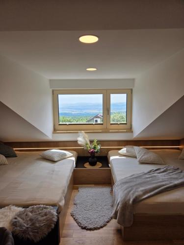 Postel nebo postele na pokoji v ubytování Štít Deluxe Studio