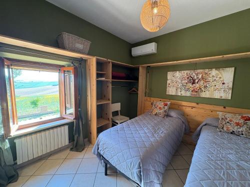 Postel nebo postele na pokoji v ubytování Casale Monte Amato