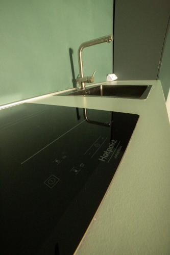 a sink in a bathroom with a sink at Maison Le Blanc Luxury B&B in Giovinazzo