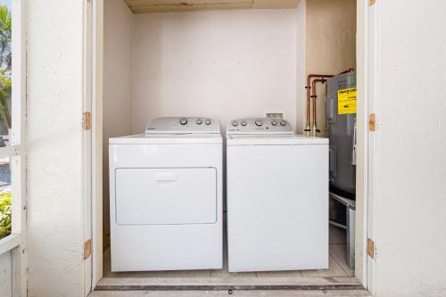 a kitchen with two appliances in a room at Bianco Sands By Beachside Management in Siesta Key