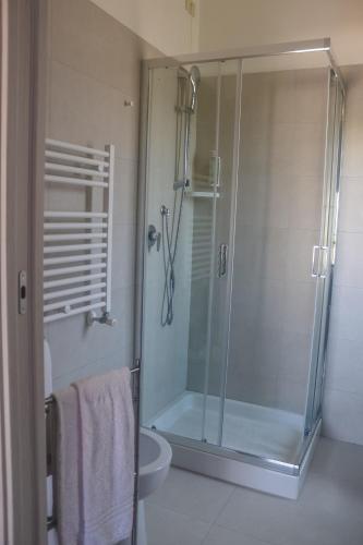 a bathroom with a shower with a glass door at Hotel Lory My Wellness SPA in Chianciano Terme