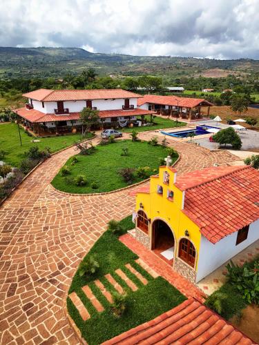 an aerial view of a building with a yard at Hotel Palais Barichara in Barichara