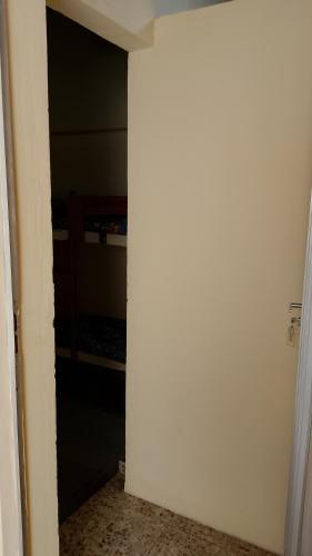 an open door to a room with a closet at Pousada Angelical in Saquarema
