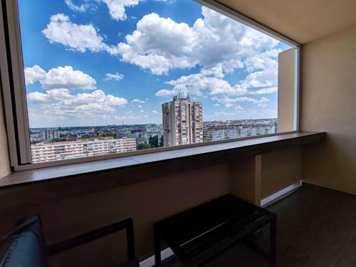 a large window with a view of a city at Princ lux spa with sauna and jacuzzi in Novi Sad