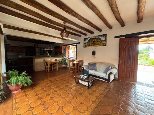 a living room with a couch and a table at Hotel Palais Barichara in Barichara