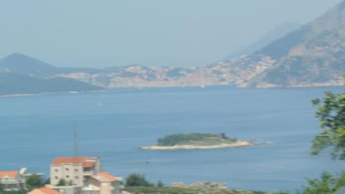 an island in the middle of a large body of water at Apartments Boras 2 in Cavtat