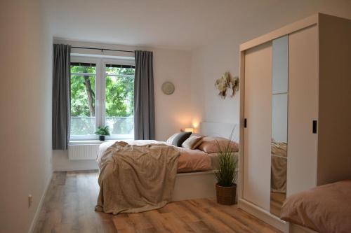 Postel nebo postele na pokoji v ubytování Apartmán u Fontány 2-free parking