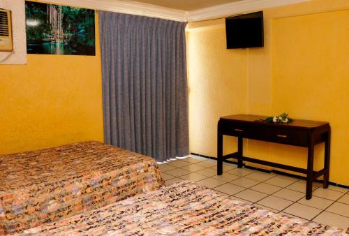Postel nebo postele na pokoji v ubytování Hotel Suites Elia Noemi