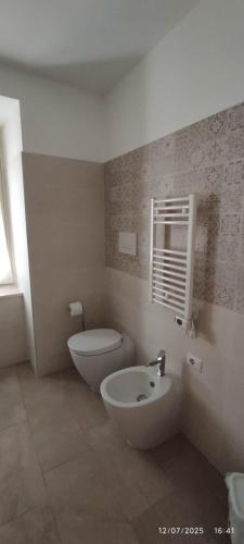 a bathroom with a toilet and a sink at Casa Sofia in Condrò