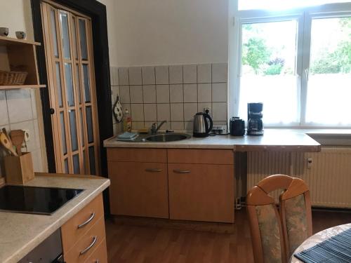 a kitchen with a sink and a counter top at Ferienwohnung Zur Weißen Taube in Dobbertin