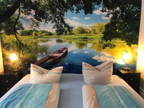 a bedroom with two beds with a view of a lake at Ferienwohnung Zur Weißen Taube in Dobbertin