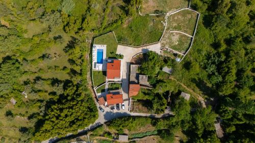 an aerial view of a house in the forest at Villa Goranovic in Herceg-Novi