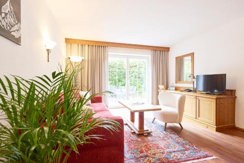 Hotel Hubertusにあるテレビまたはエンターテインメントセンター