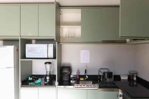 Dapur atau dapur kecil di Lou Suítes - Suíte 07 - Conforto e Paz