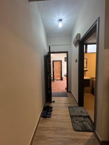 a hallway with a door leading to a room at Lovely apartment in Genting Highlands. in Genting Highlands
