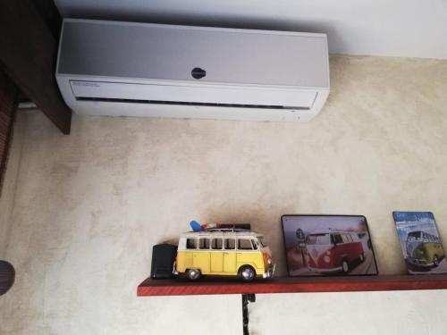 a toy van sitting on a shelf under a ceiling at Bungalow con vistas y jacuzzi en Gran Alacant GA102 in Puerto Marino