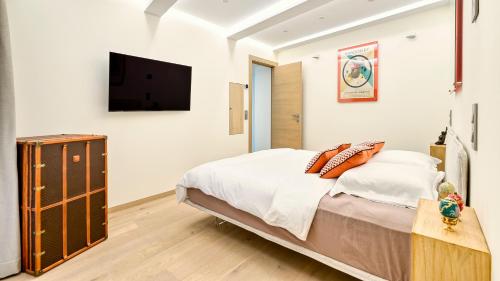 Ein Bett oder Betten in einem Zimmer der Unterkunft Le Palais Aubernon