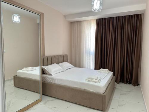 Ένα ή περισσότερα κρεβάτια σε δωμάτιο στο Adan Luxury Aparthotel
