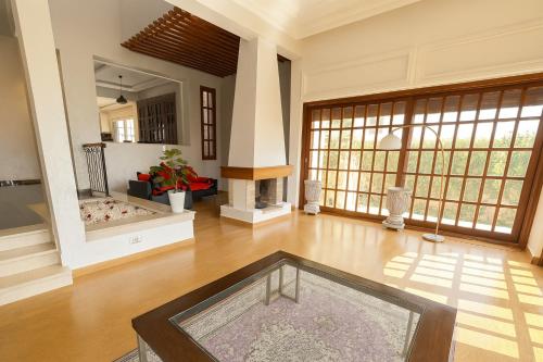 a large living room with a table in the middle at Spacious villa in Founty, beach side 40m front Sofitel in Agadir