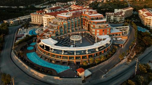 an aerial view of a large building with a fountain at Qlusive Hotel in Kusadası