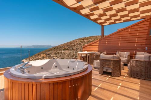 a hot tub on the deck of a house at Qlusive Hotel in Kusadası