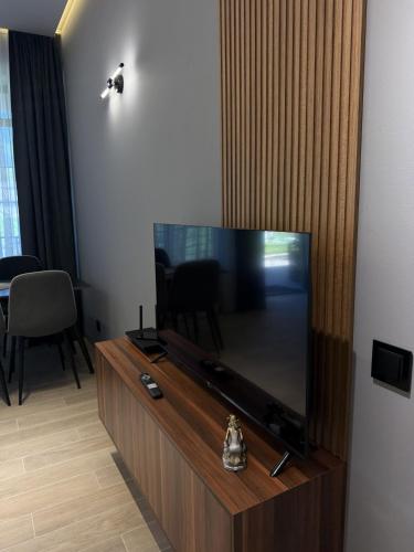 a living room with a large flat screen tv at BOND HOUSE Dilijan in Dilijan