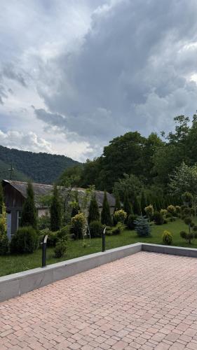 a brick patio with a view of a garden at BOND HOUSE Dilijan in Dilijan