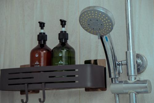 two bottles of wine on a holder with a blow dryer at 泊悦国际大酒店 BoYue Hotel in Addis Ababa Bole International Airport