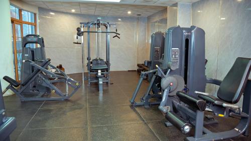 a gym with several tread machines in a room at 泊悦国际大酒店 BoYue Hotel in Addis Ababa Bole International Airport