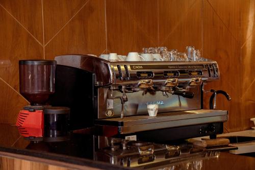 a coffee machine sitting on top of a counter at 泊悦国际大酒店 BoYue Hotel in Addis Ababa Bole International Airport