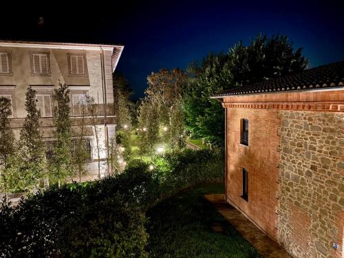 a view of a building and a yard at night at The Monteleone Umbria Retreat in Monteleone dʼOrvieto