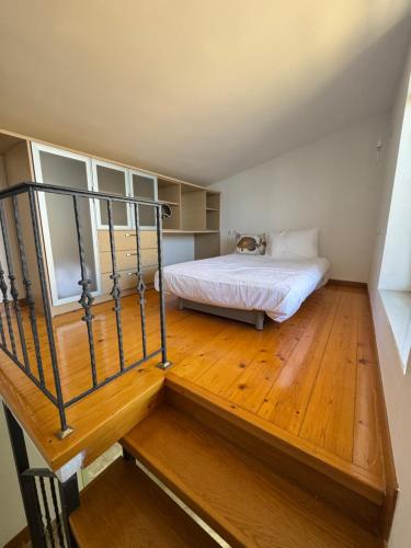 a bedroom with a bed with a dog laying on it at Aegina Horizon Stonehouse No I in Aegina