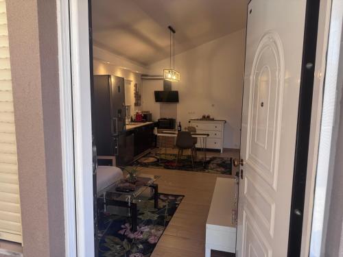 a view of a living room and kitchen from a door at Maria House in Artemida
