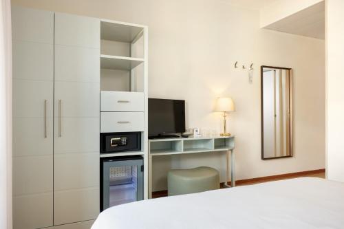 Letto o letti in una camera di Hotel Croce Di Malta