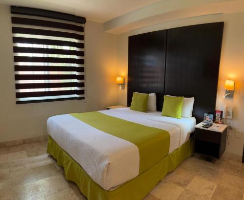 Katil atau katil-katil dalam bilik di Hotel del Pescador