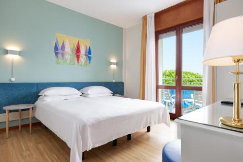Кровать или кровати в номере Hotel Croce Di Malta