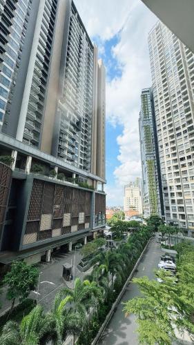 a view of a city with tall buildings and palm trees at Masteri An Phu - Condo 1-2BR Apartment with Pool GYM D2 in Ho Chi Minh City