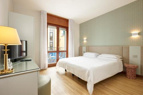 Letto o letti in una camera di Hotel Croce Di Malta