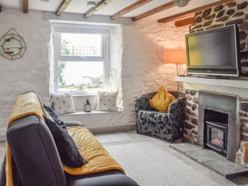 Posezení v ubytování Bee Cottage