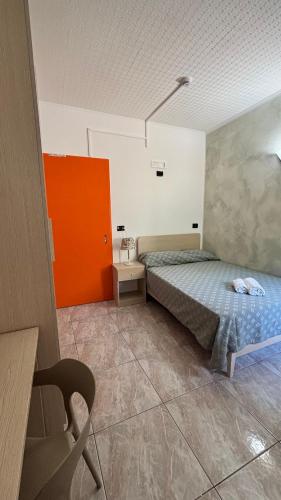 Ένα ή περισσότερα κρεβάτια σε δωμάτιο στο Hotel Il Gabbiano
