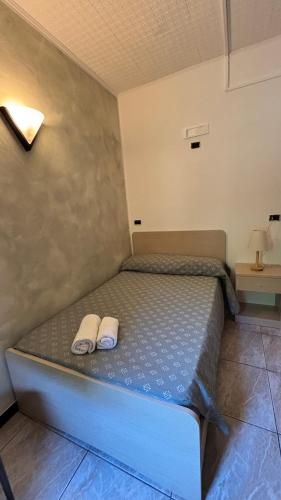 Ένα ή περισσότερα κρεβάτια σε δωμάτιο στο Hotel Il Gabbiano