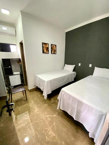 Katil atau katil-katil dalam bilik di Hotel Uirapuru 02