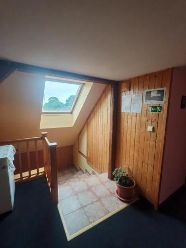 a room with a skylight in the middle of a building at Nord in Hora Svatého Šebestiána