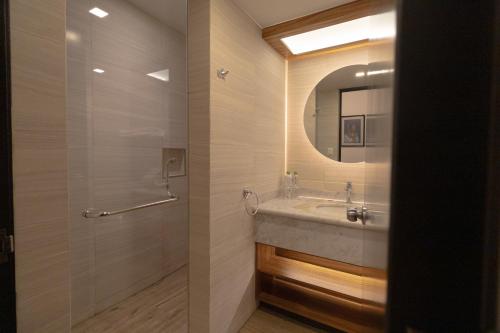 a bathroom with a sink and a mirror at Hotel Boutique Naura Centro in Oaxaca City