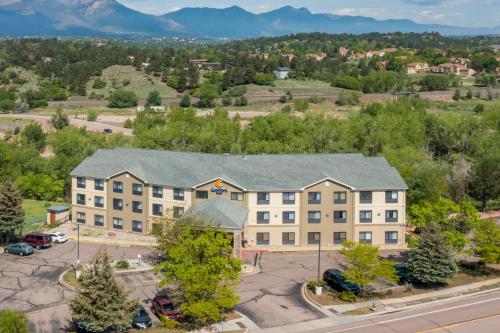an aerial view of a hotel with mountains in the background at Comfort Inn North - Air Force Academy Area in Colorado Springs